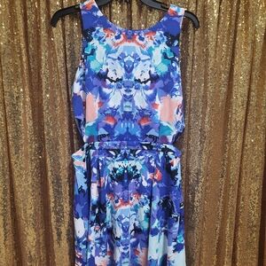 Water color dress with skater style skirt and peekaboo detail.